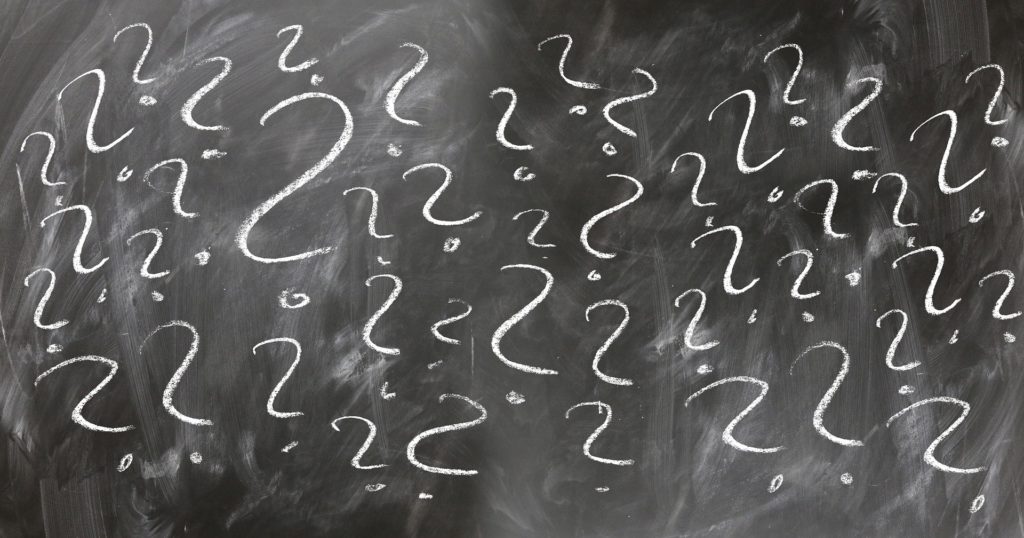 question marks on a chalk board