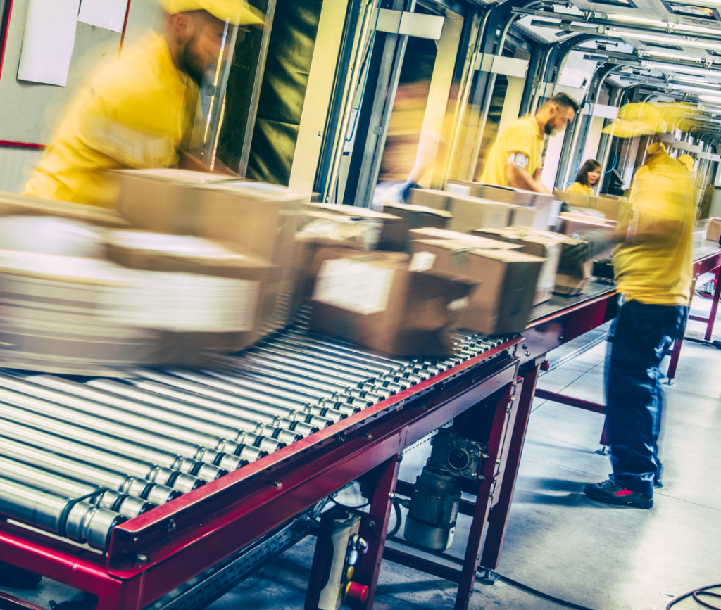 warehouse workers at speed on delivery shipments