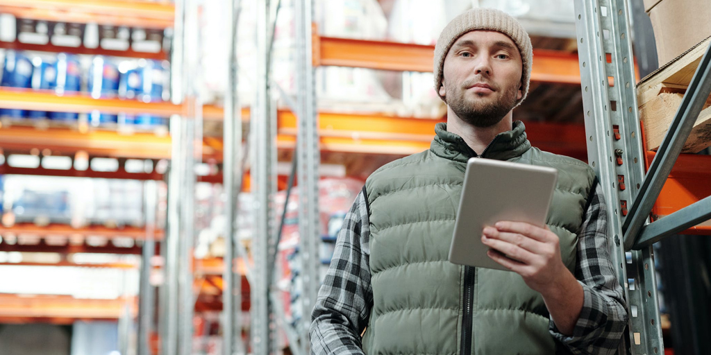 Man in warehouse using carrier Integration Software