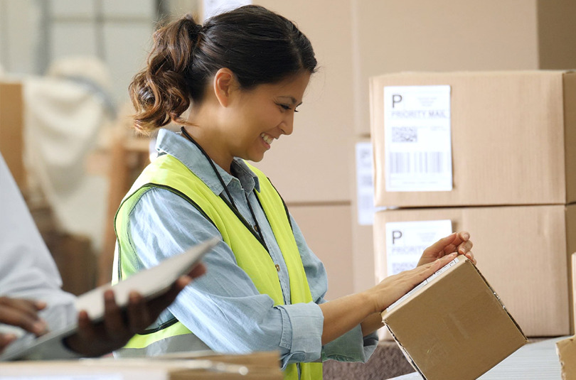 Warehouse worker using multi-carrier shipping software