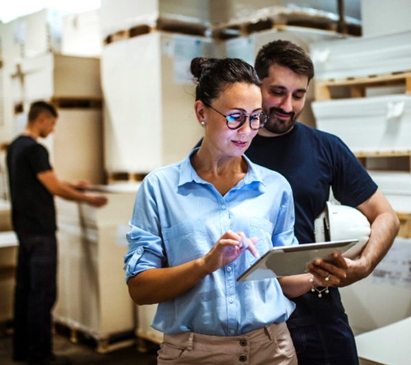 Warehouse staff using last mile delivery tracking