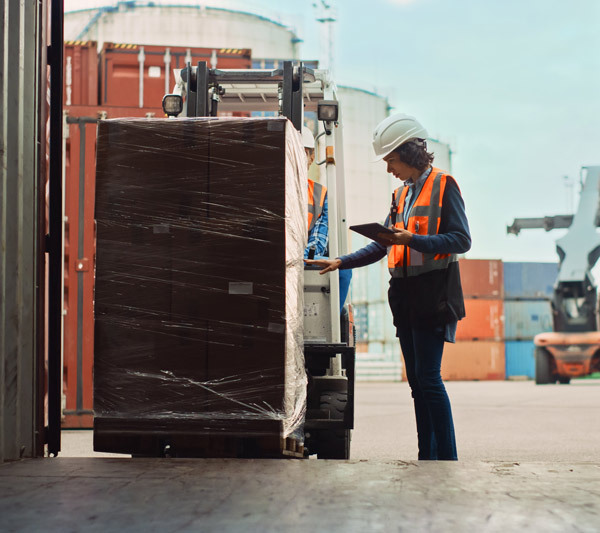 Worker preparing pallet shipment