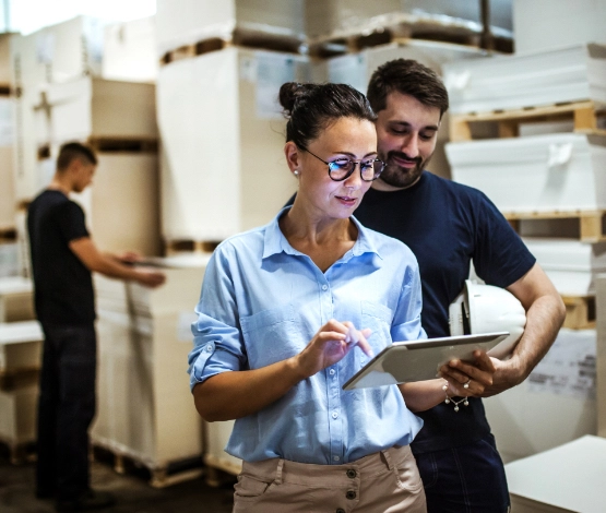 Workers using multi-carrier shipping software