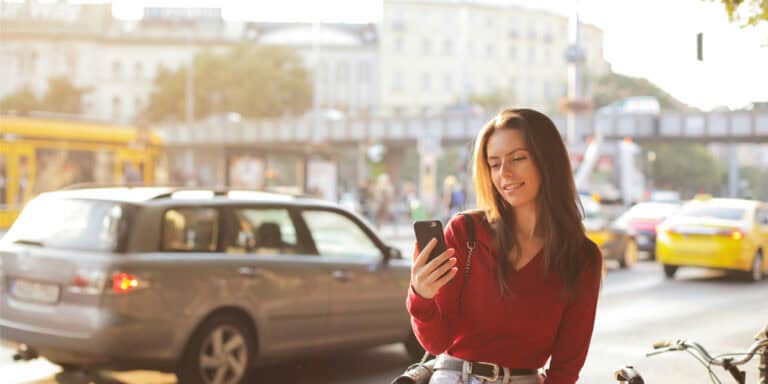 Consumer enjoying eCommerce Email Marketing on her phone